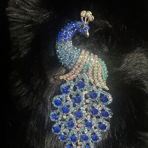 Blue crystal encrusted peacock brooch new